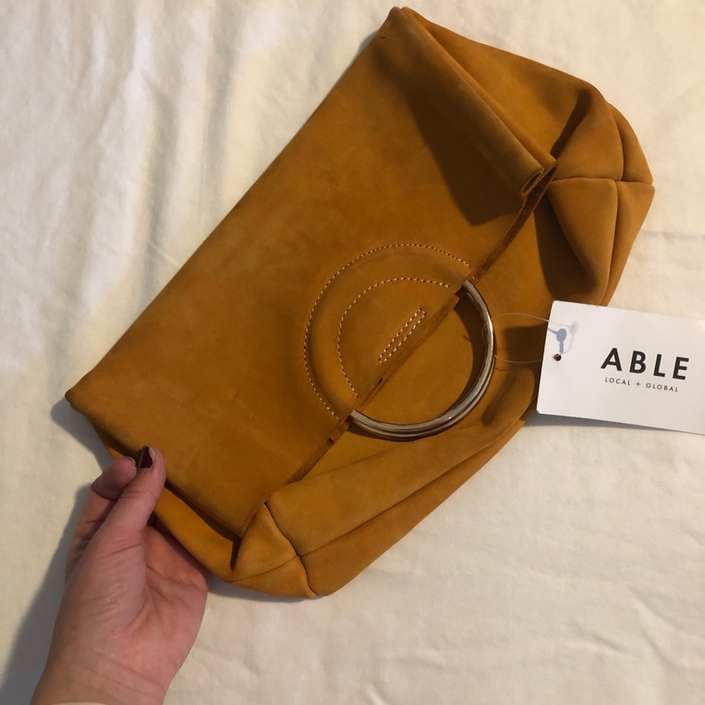 ABLE leather clutch.